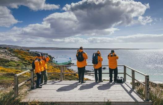 Passengers viewing the coast